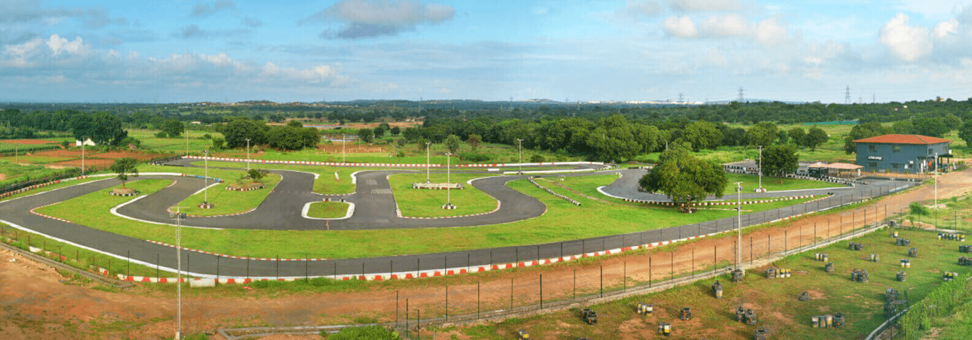 Wide panoramic shot of an elaborate outdoor go-kart racing track at Level 2 Go-Karting Hyderabad.